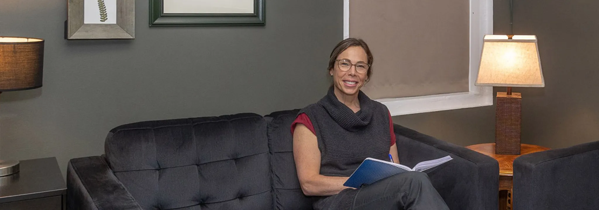 Karyn Dowdall on couch in office