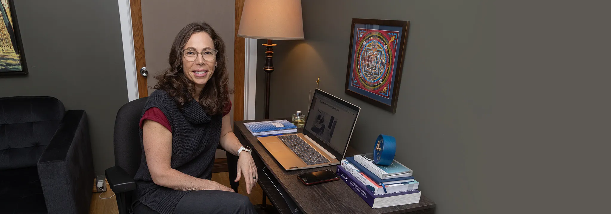 Karen Dowdall in her office offering virtual services